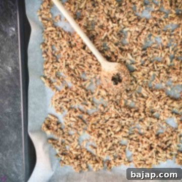 Spread the mixture on a lined baking sheet and bake.