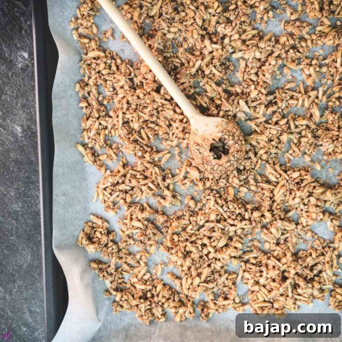 Spread the mixture on a lined baking sheet and bake.