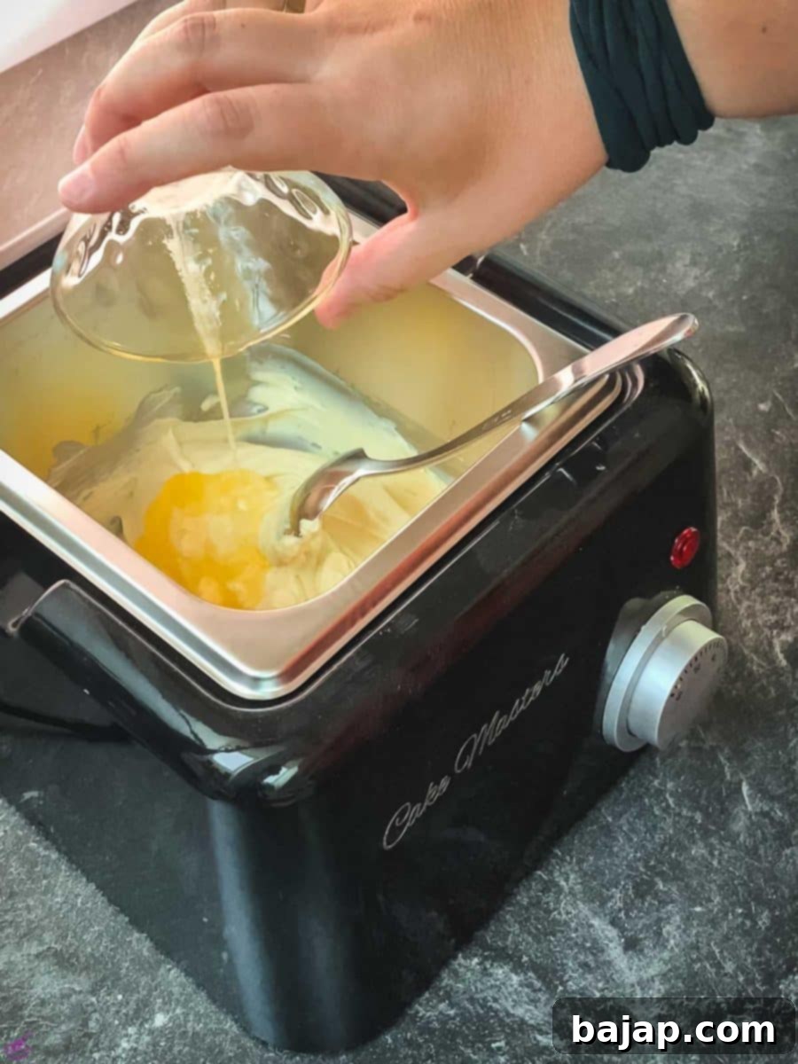 Add the melted butter to the melted white chocolate, preparing to combine ingredients.