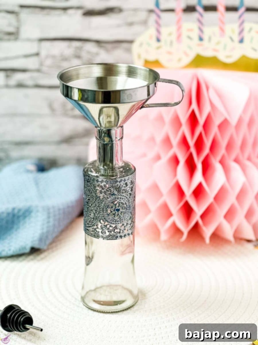 Bottle fitted with funnel.