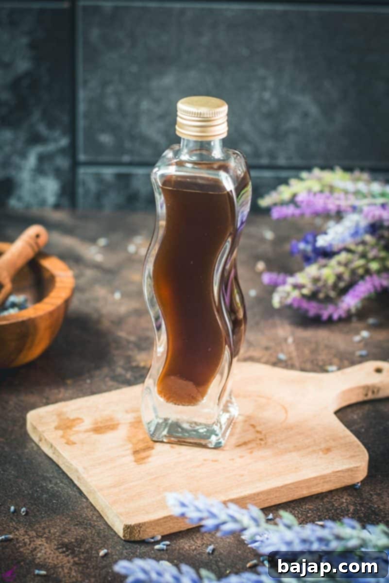 A curved bottle filled with homemade lavender extract, gracefully placed on a rustic brown wooden board, surrounded by fresh lavender flowers, ready to infuse your recipes with floral notes.