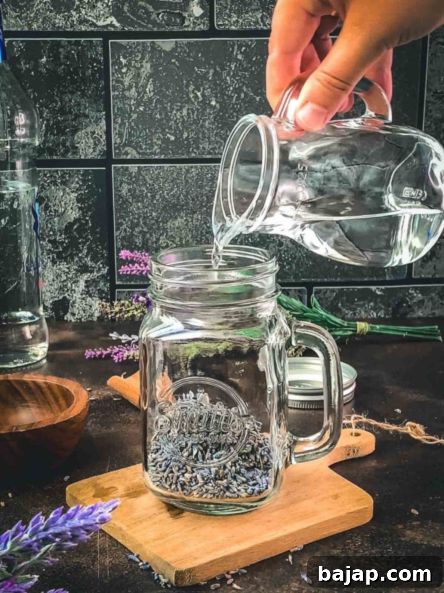 Carefully fill the mason jar with vodka, ensuring the dried lavender is completely covered for optimal flavor extraction.