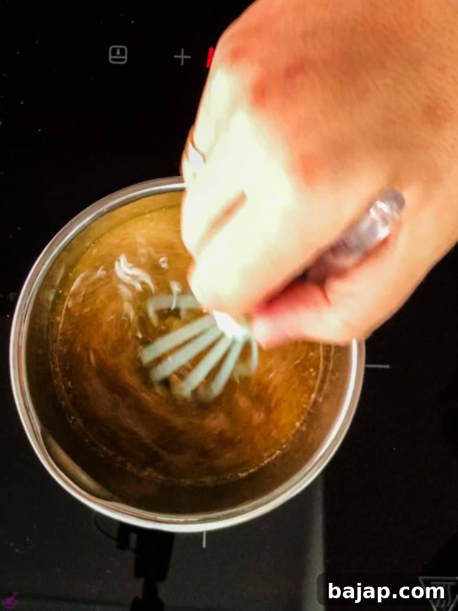 Combine the melted butter with the instant coffee.