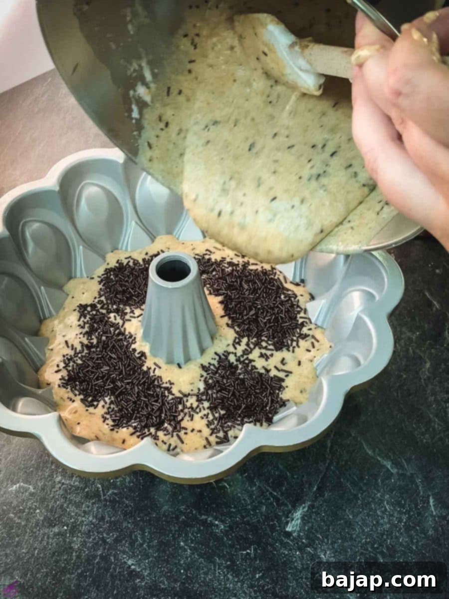 After adding a layer of chocolate sprinkles, add the remaining cake batter.