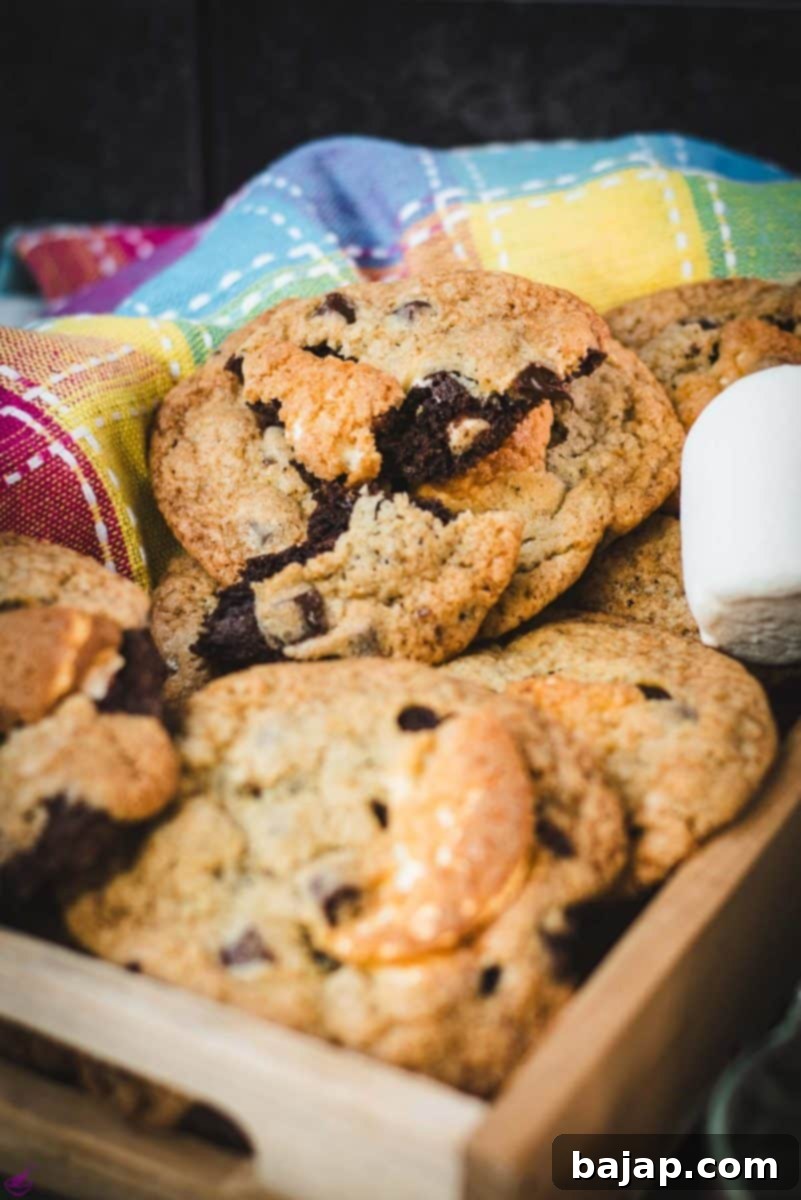 Ugly but delicious chocolate chip marshmallow cookies, placed on wooden tray plate.