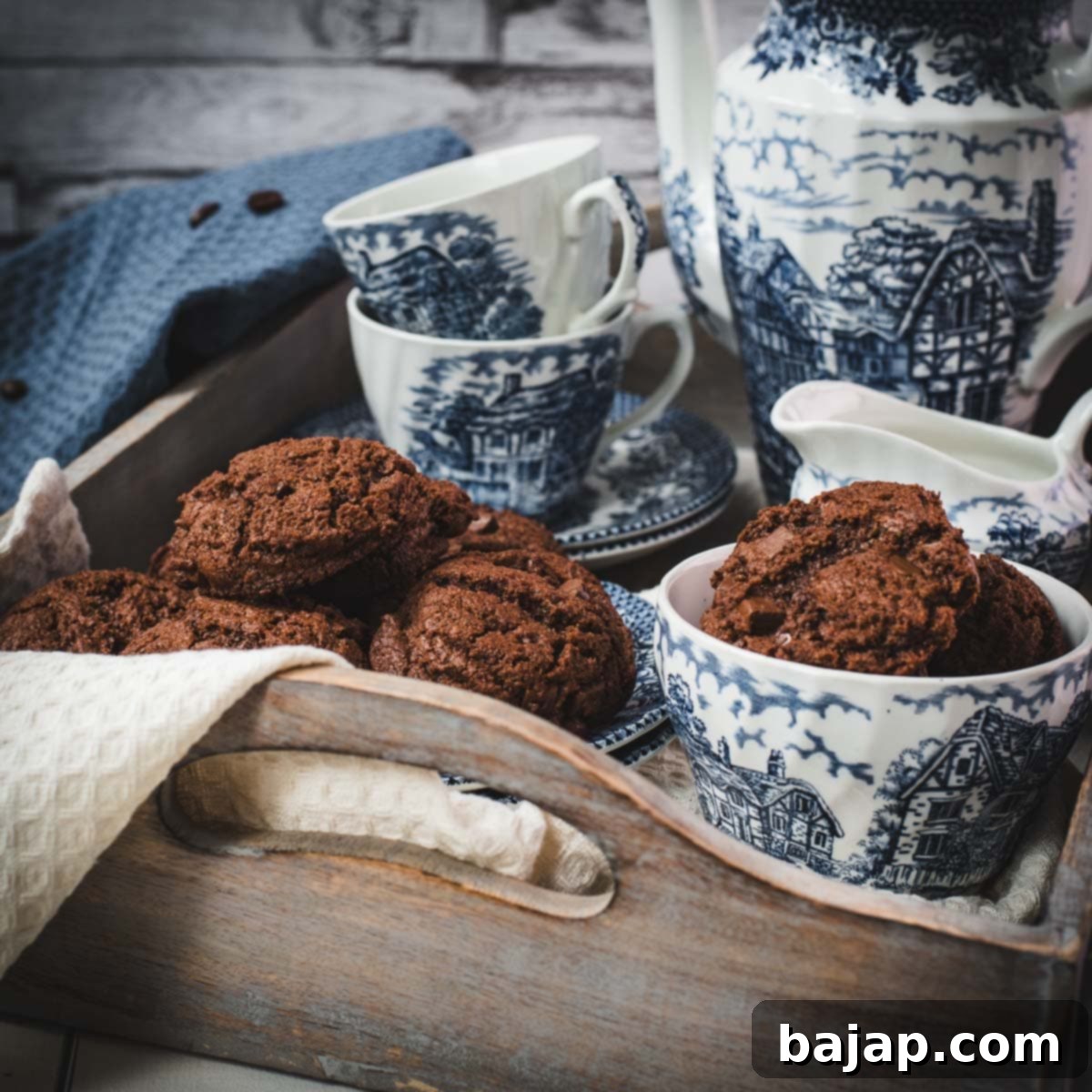 Beautiful coffee chocolate chip cookies, on blue white porcelain.