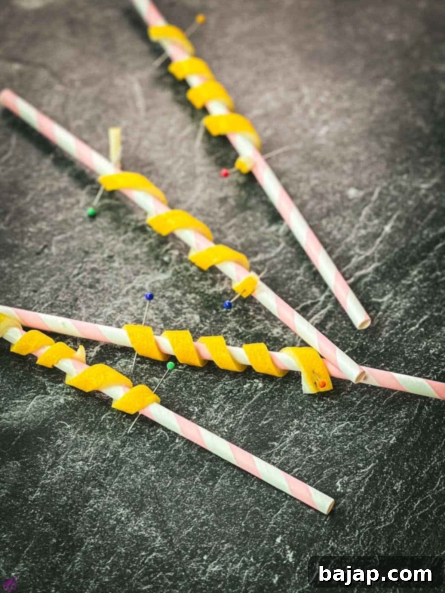 Finished lemon twists pinned on paper straw.