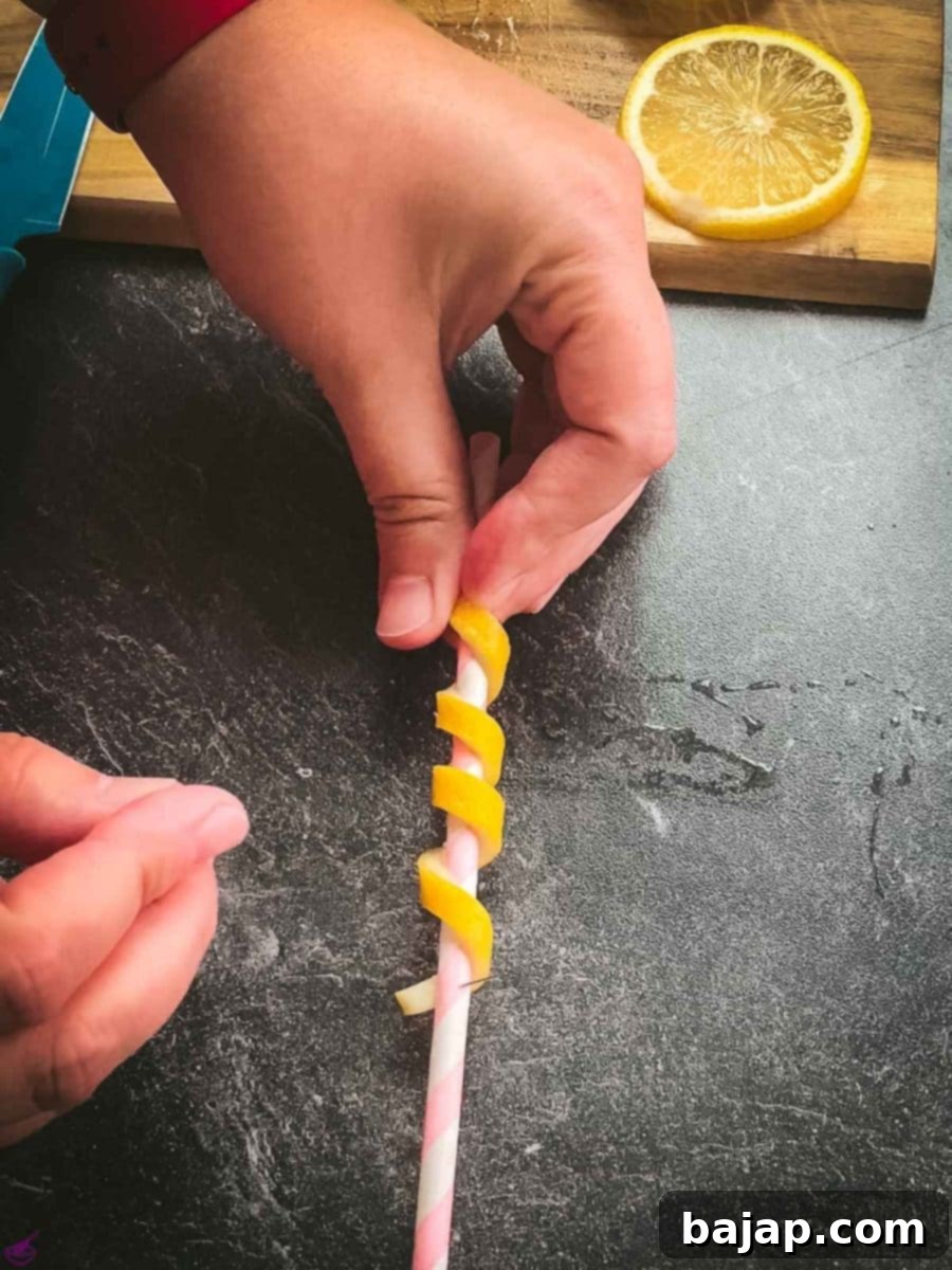 Wrap the lemon peel tightly around a paper straw.