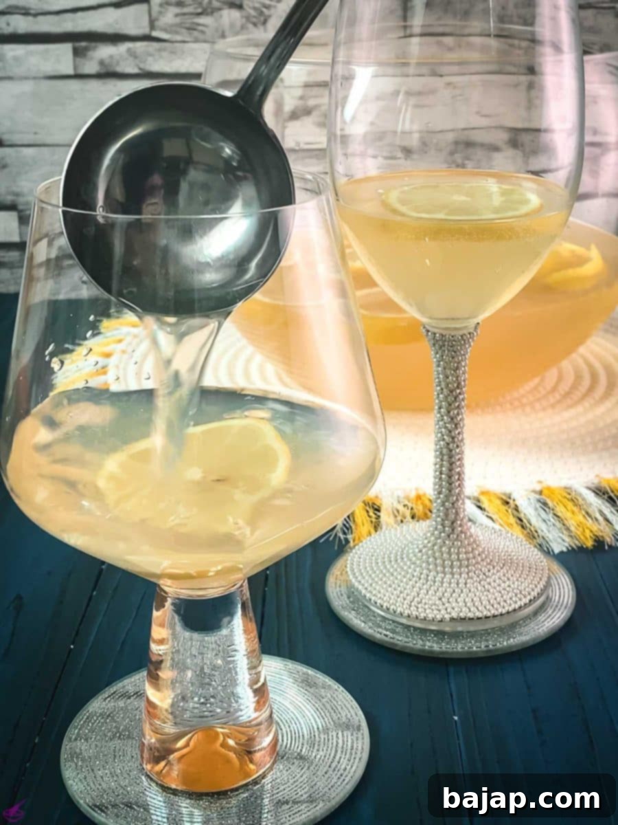 Sparkling Citrus Celebration 8 A ladle expertly scoops the effervescent New Year's Lemon Punch into a serving glass, showcasing its vibrant color and festive bubbles.