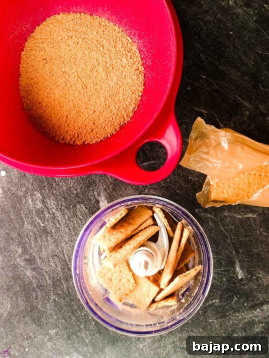 Crush the graham cracker sheets with a food processor into little crumbs.
