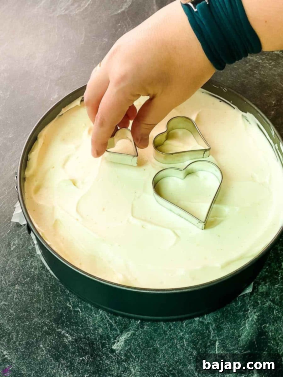 Place the heart shaped cookie cutters on top of the cream cheese filling.