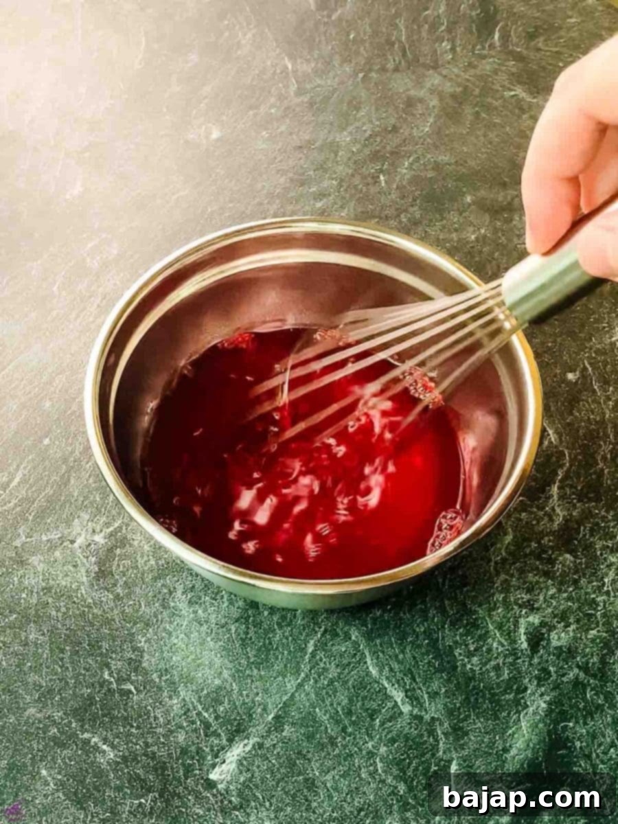 Mix the raspberry jello well with the boiling water.
