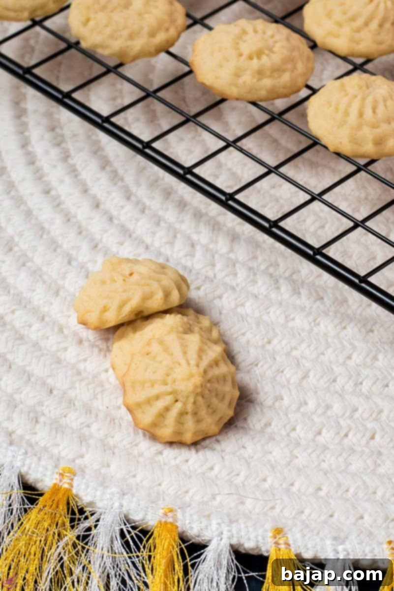 Three gorgeous mini lemon sugar cookies placed next to each other.