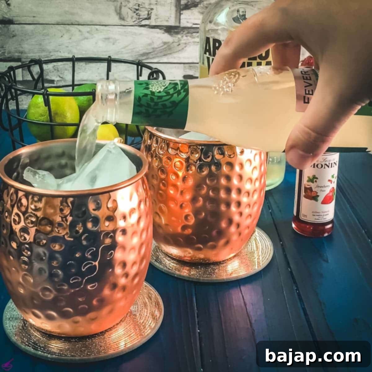 Pouring ginger beer into the copper mug.