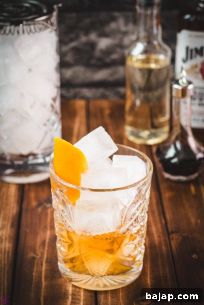 Gorgous glass filled with a delicious old fashioned drink.
