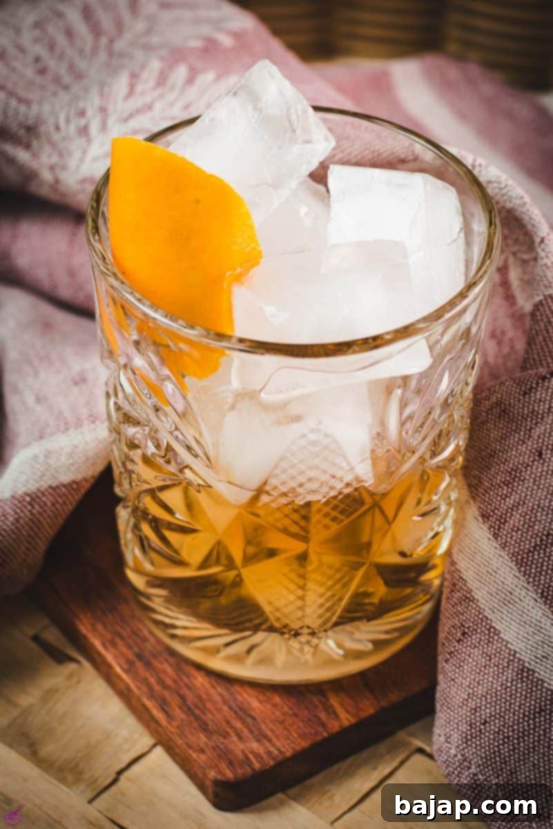 A beautifully presented Old Fashioned cocktail, ready to be enjoyed, reflecting the elegance of proper bar equipment.