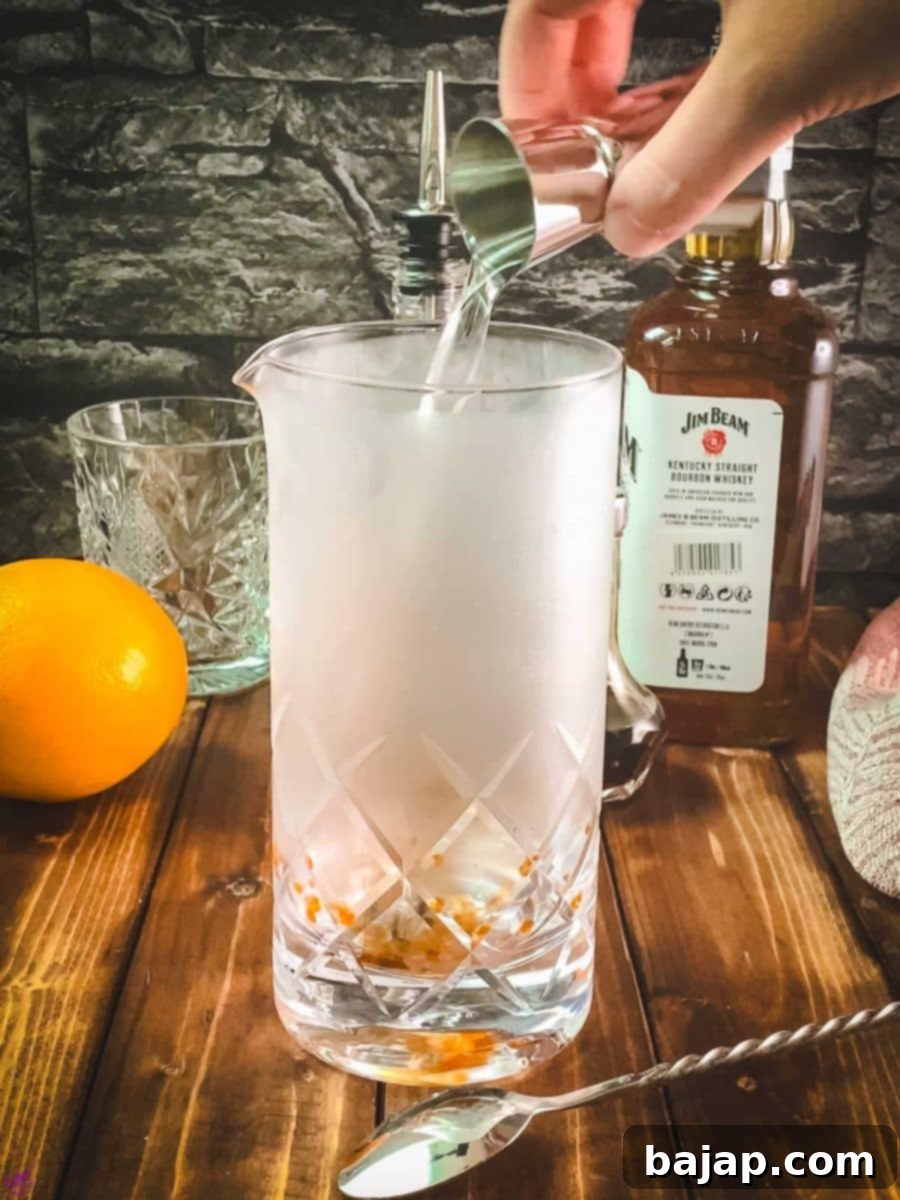 Pouring sugar syrup into the stirring glass.