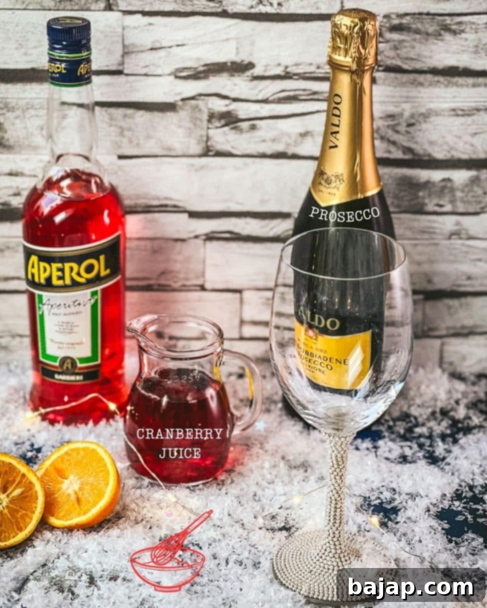 Three ingredients are required for making a Winter Aperol Spritz - Aperol, cranberry juice and prosecco.