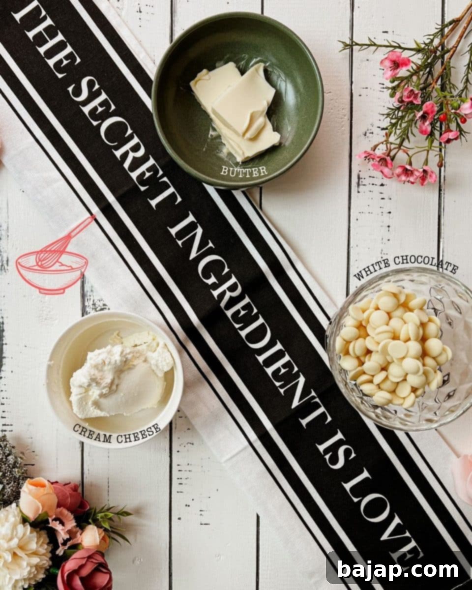 Three core ingredients for cream cheese frosting: softened unsalted butter, creamy cream cheese, and fine powdered sugar, presented on a rustic wooden background.
