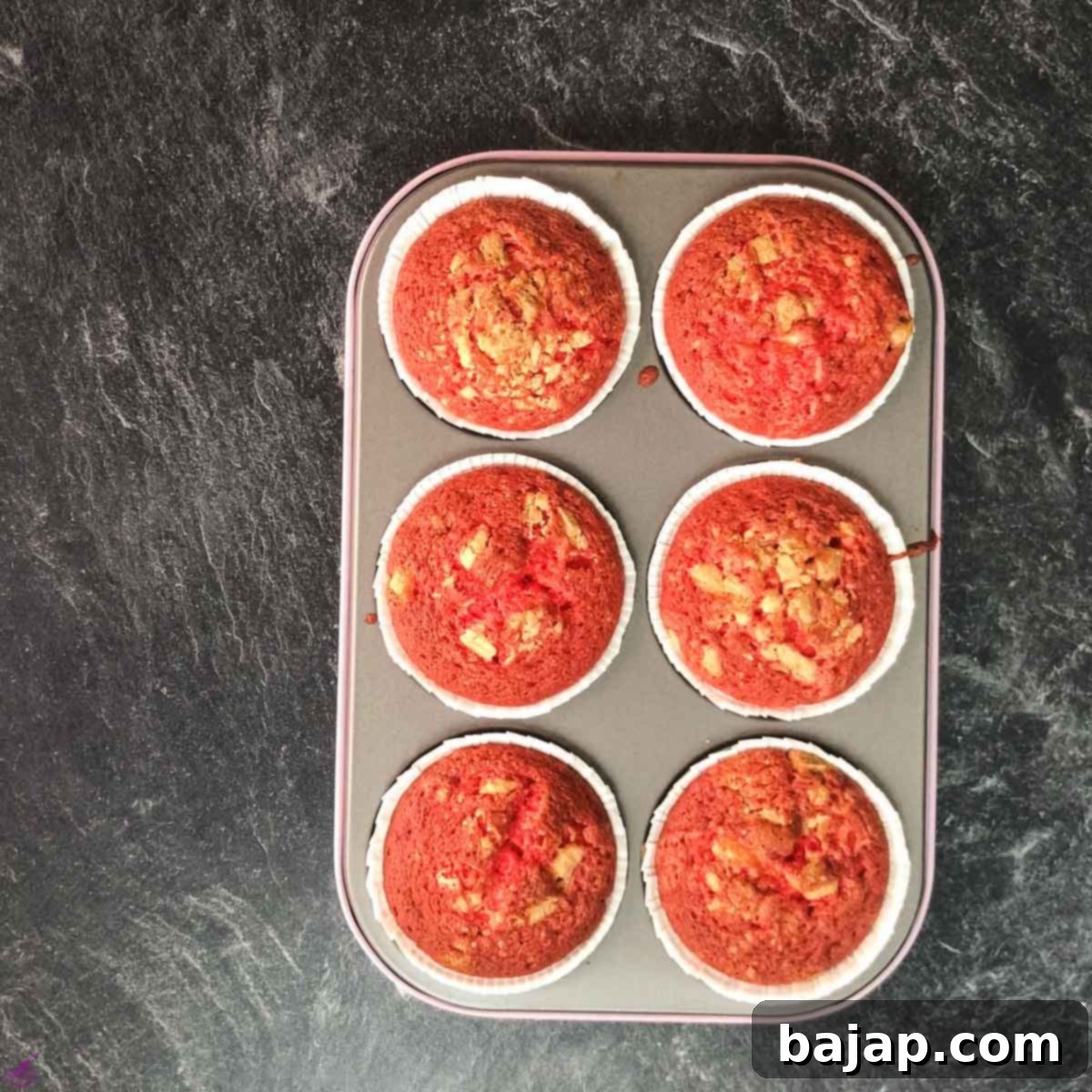 Finished baked red velvet muffins in muffin form.