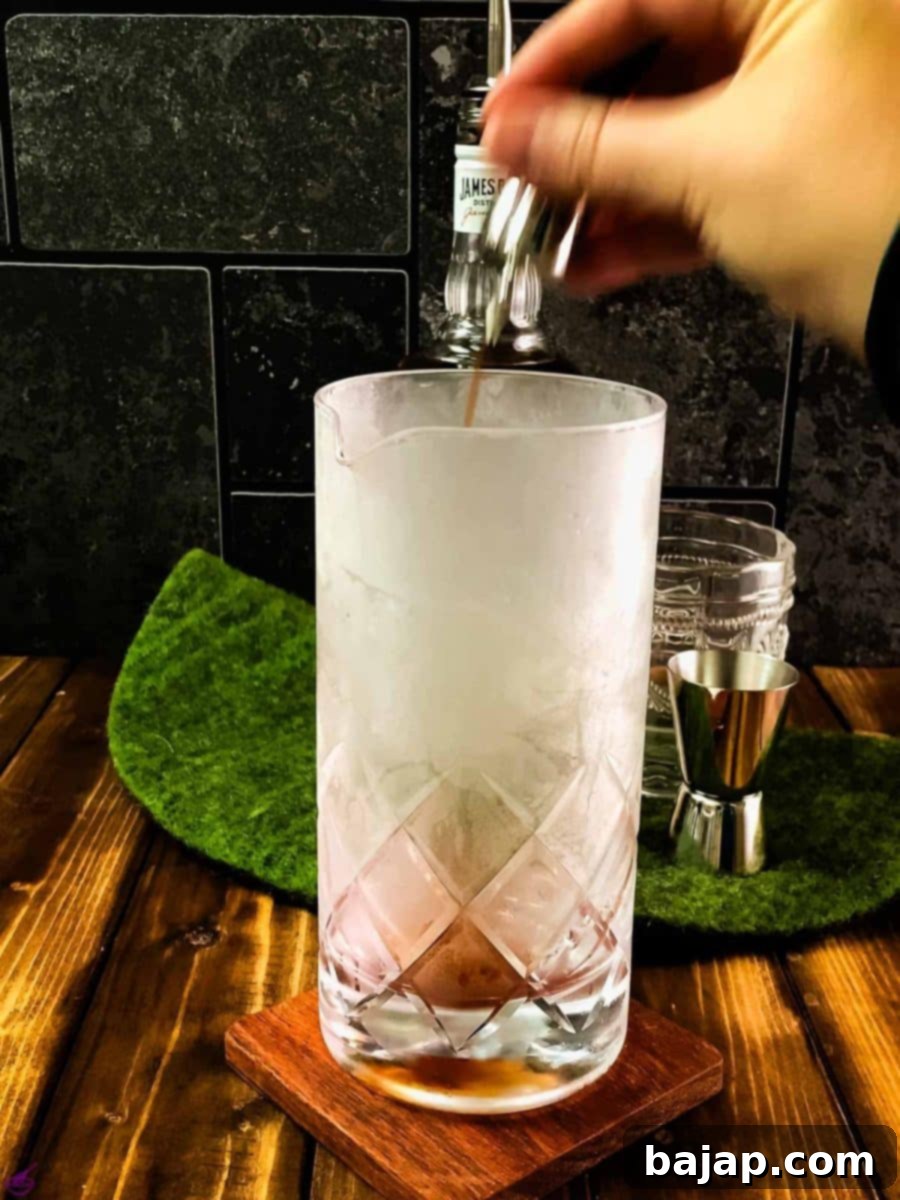 Add 3 dashes Angostura bitters to the stirring glass.