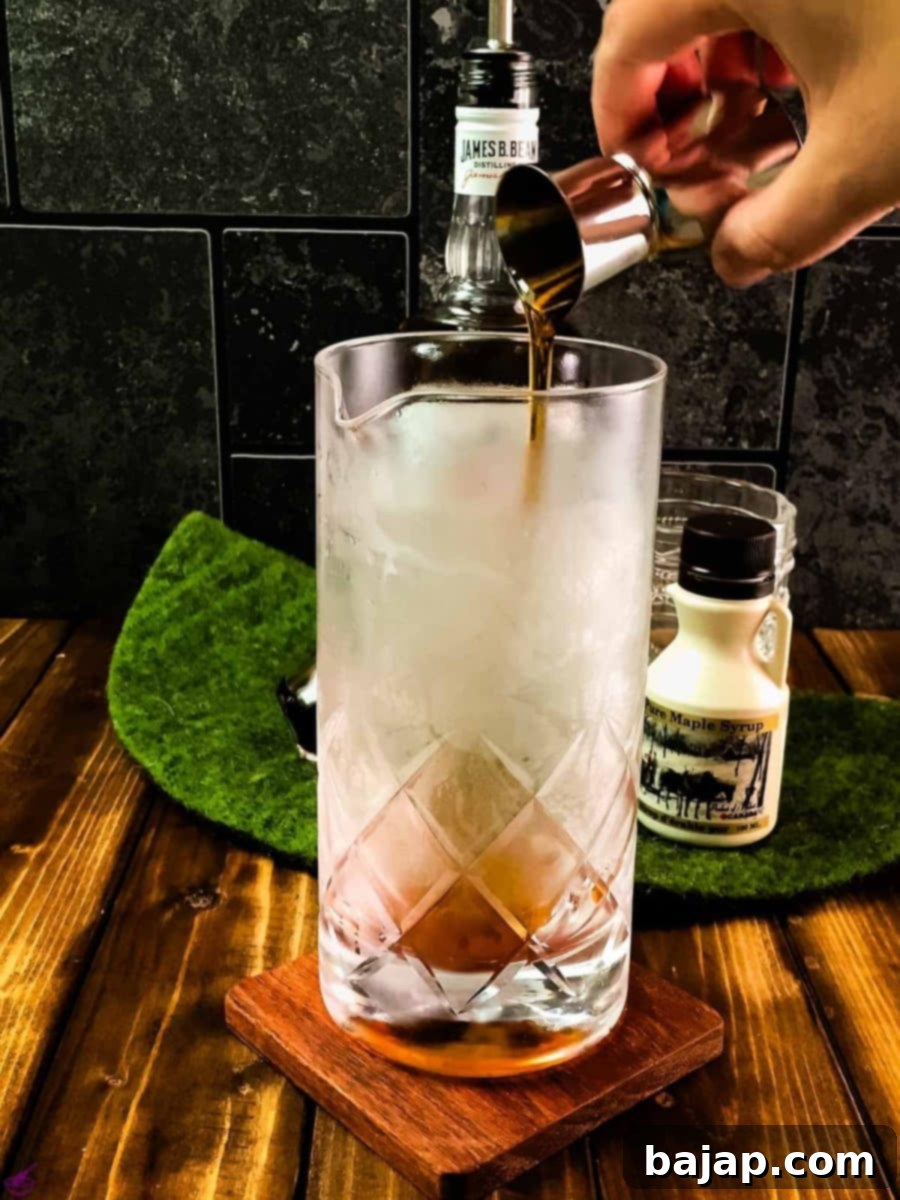 Add maple syrup to the stirring glass.