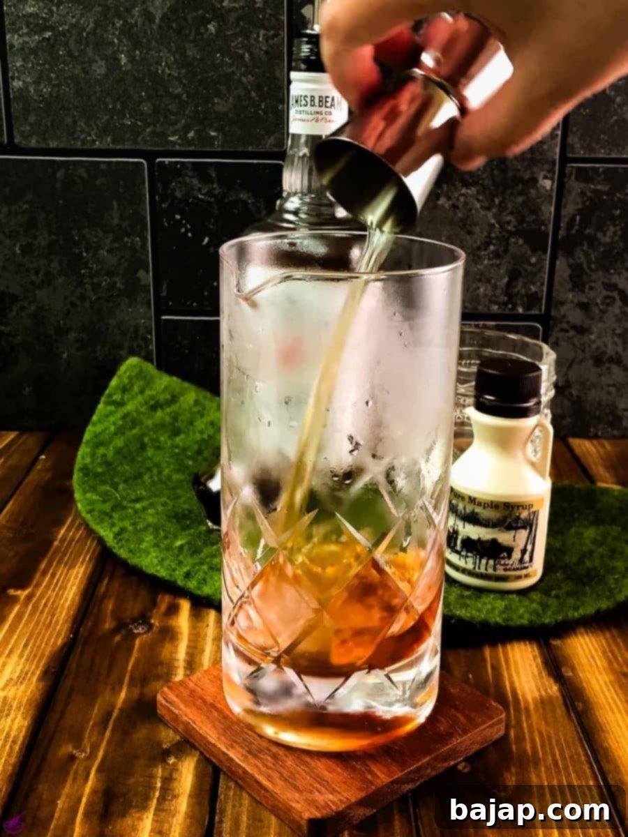 Add bourbon to the stirring glass.