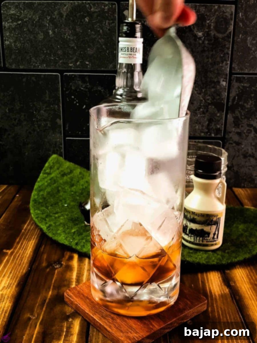 Golden Maple Old Fashioned 6 Add cubed ice to your stirring glass.