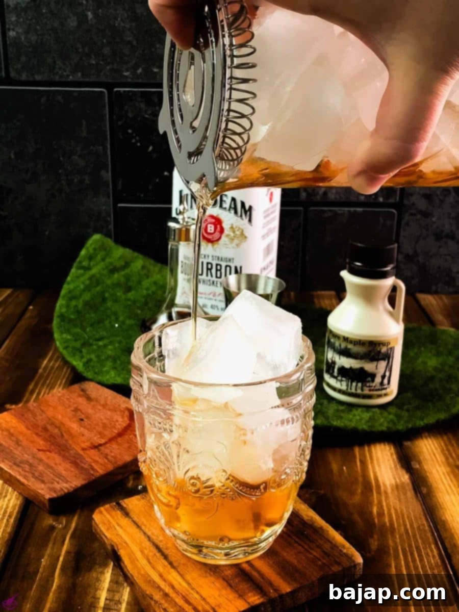 Pour your maple old fashioned into a rocks glass filled with cubed ice.