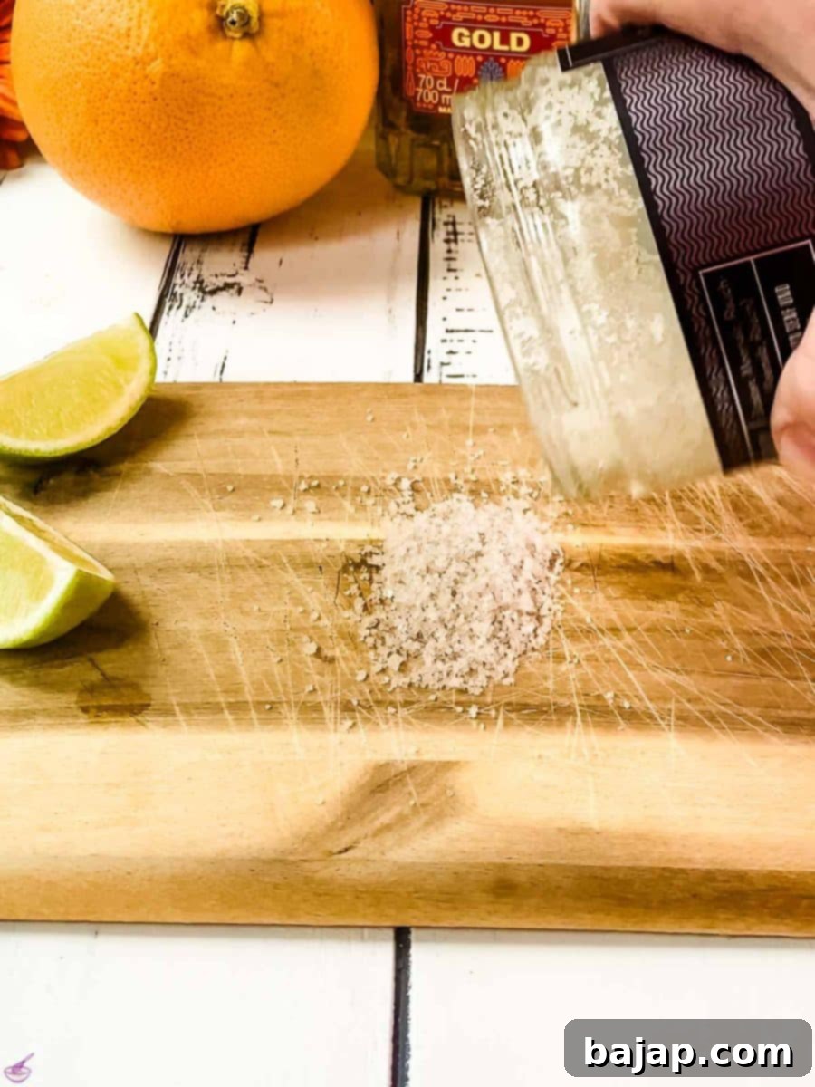Place coarse salt, such as sea salt or kosher salt, on a clean cutting board, ready for rimming the glass.