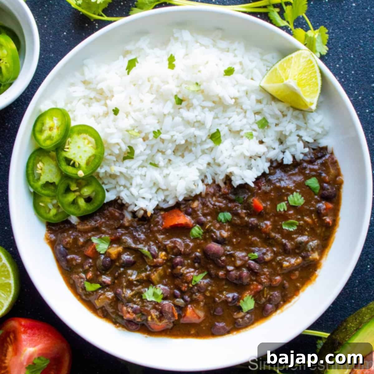 This hearty & delicious black bean soup is vegan & gluten free, loaded with veggies and greens and tastes very similar to Panera bread black bean soup.