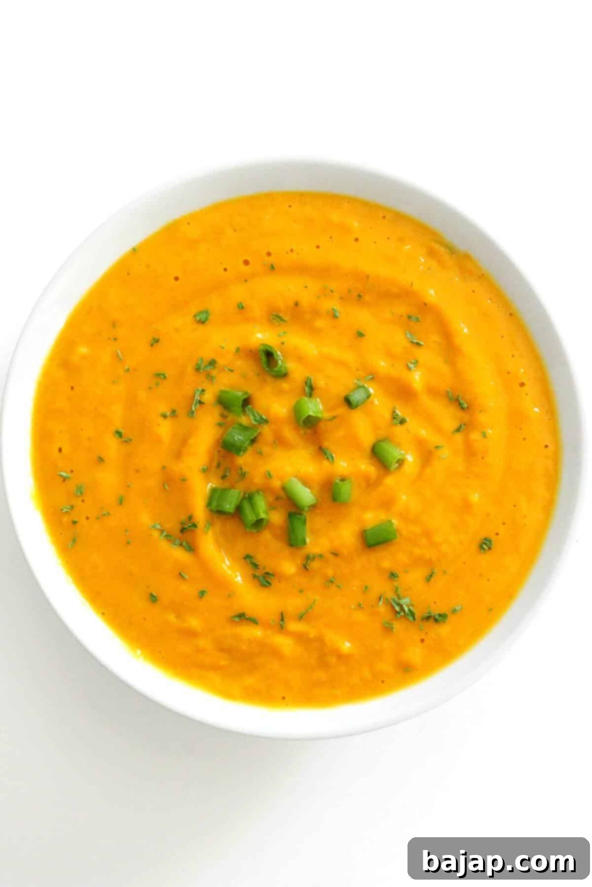 This Vegan Curried Pumpkin Soup is super creamy, smooth, and full of flavor! This easy pumpkin soup recipe is gluten-free, paleo, dairy-free, low-carb, and keto-friendly. It's healthy and quick to make with canned pumpkin puree, creamy coconut milk, and curry spices! You'll have a satisfying cozy meal ready in 15 minutes!