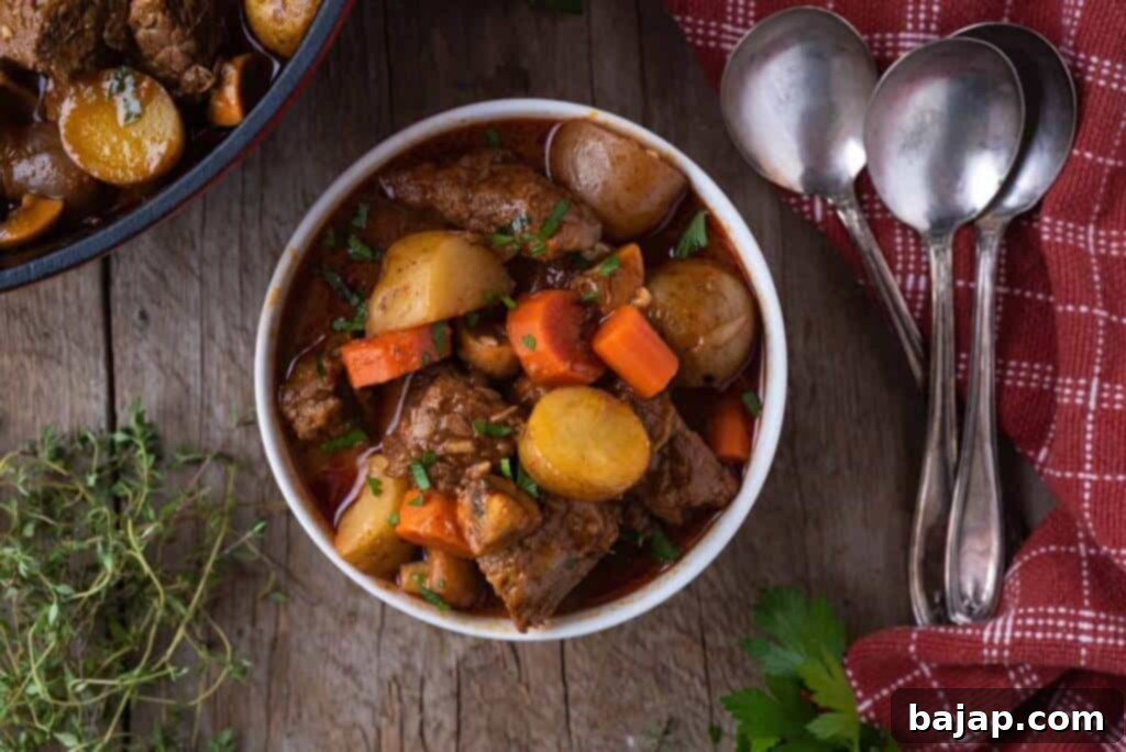 This Dutch Oven Beef Stew recipe is the perfect comfort food for a cold winter's night! Made with tender stew beef, potatoes, carrots and mushrooms it is a hearty dinner that the everyone will love.
