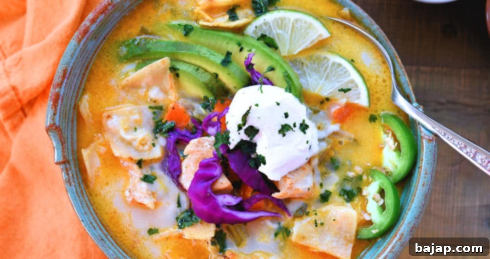 This creamy chicken tortilla soup made in the Instant Pot is bursting with a delicious mixture of chiles and juicy morsels of chicken. It's creamy and cheesy with just the right amount of heat.