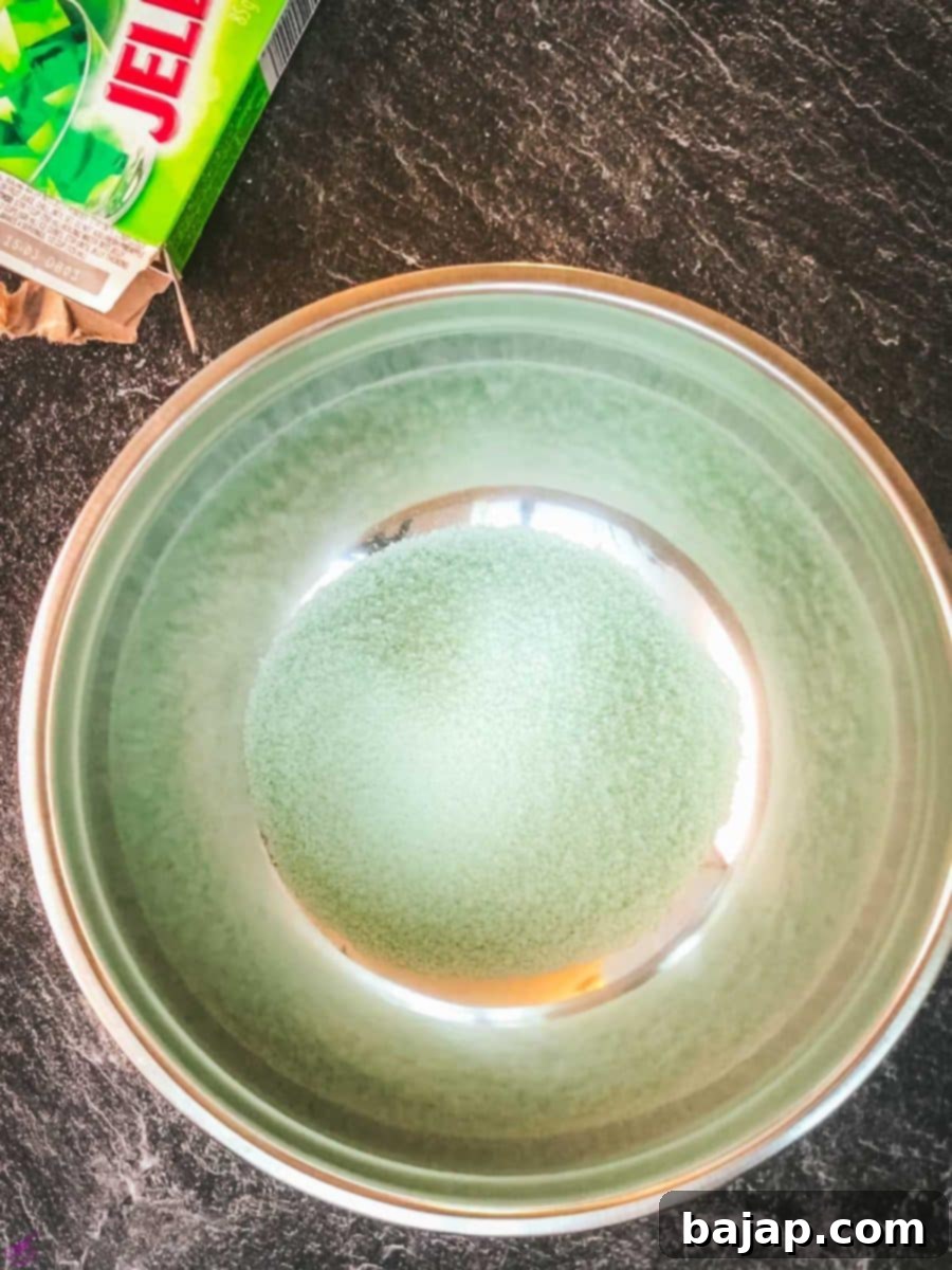 Empty the lime Jell-o mixture into a mixing bowl.
