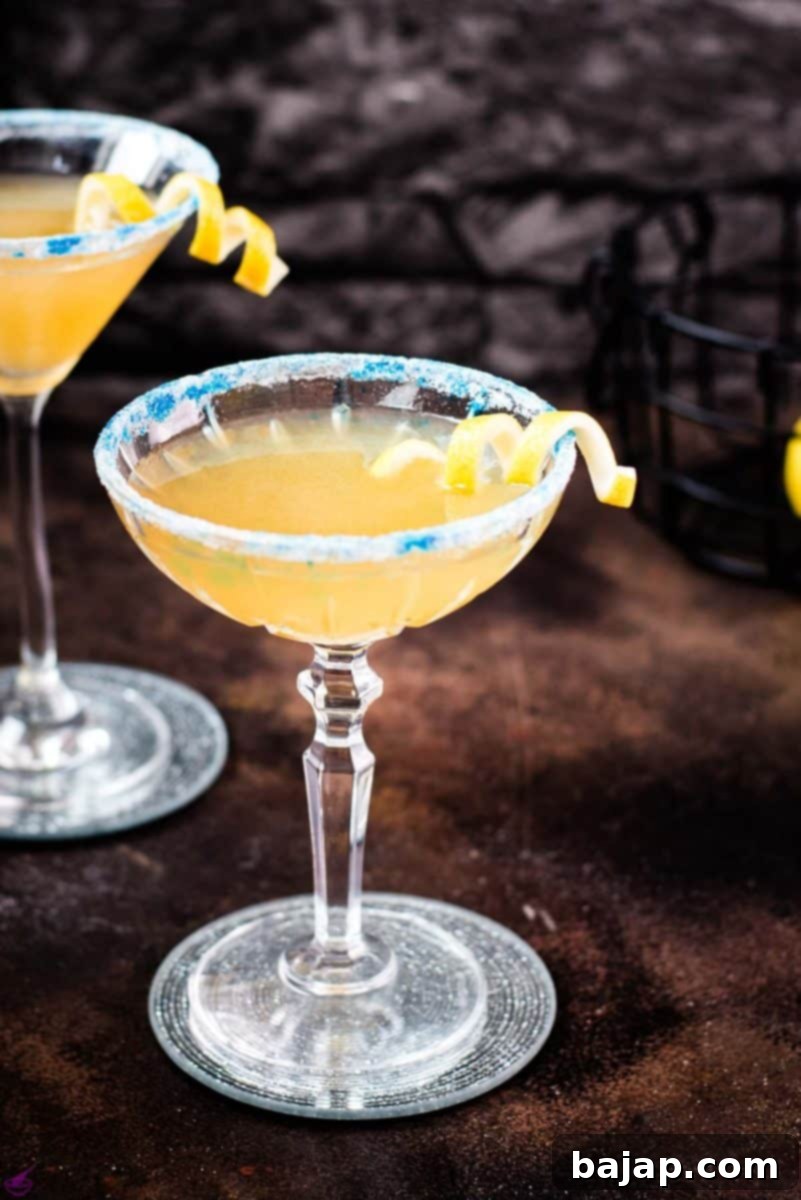 Lemon-Kissed Whiskey Sidecar 14 A stunning Whiskey Sidecar cocktail, garnished with a vibrant lemon twist and a sparkling white and blue sugar rim, ready to be enjoyed.