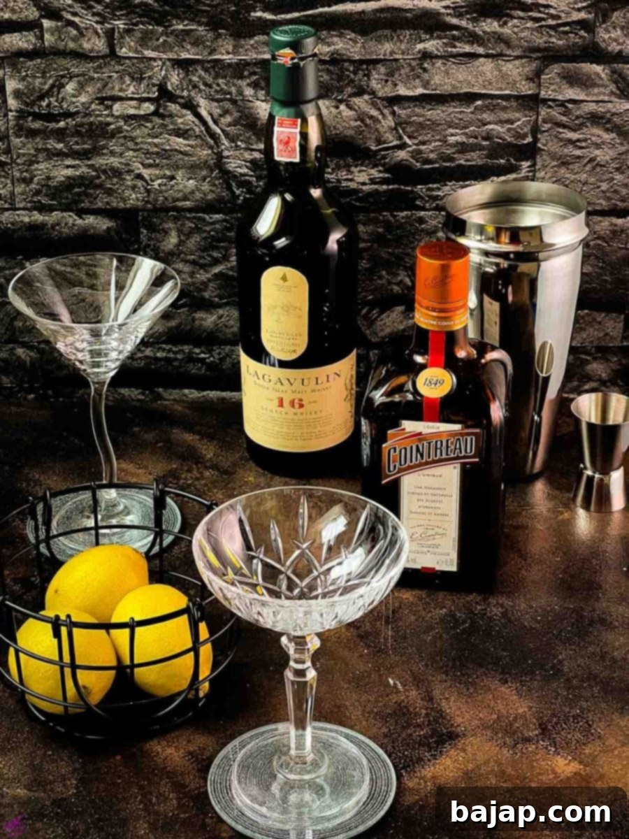 Essential ingredients for making a whiskey sidecar cocktail laid out: Whiskey, Cointreau, and fresh Lemon Juice.