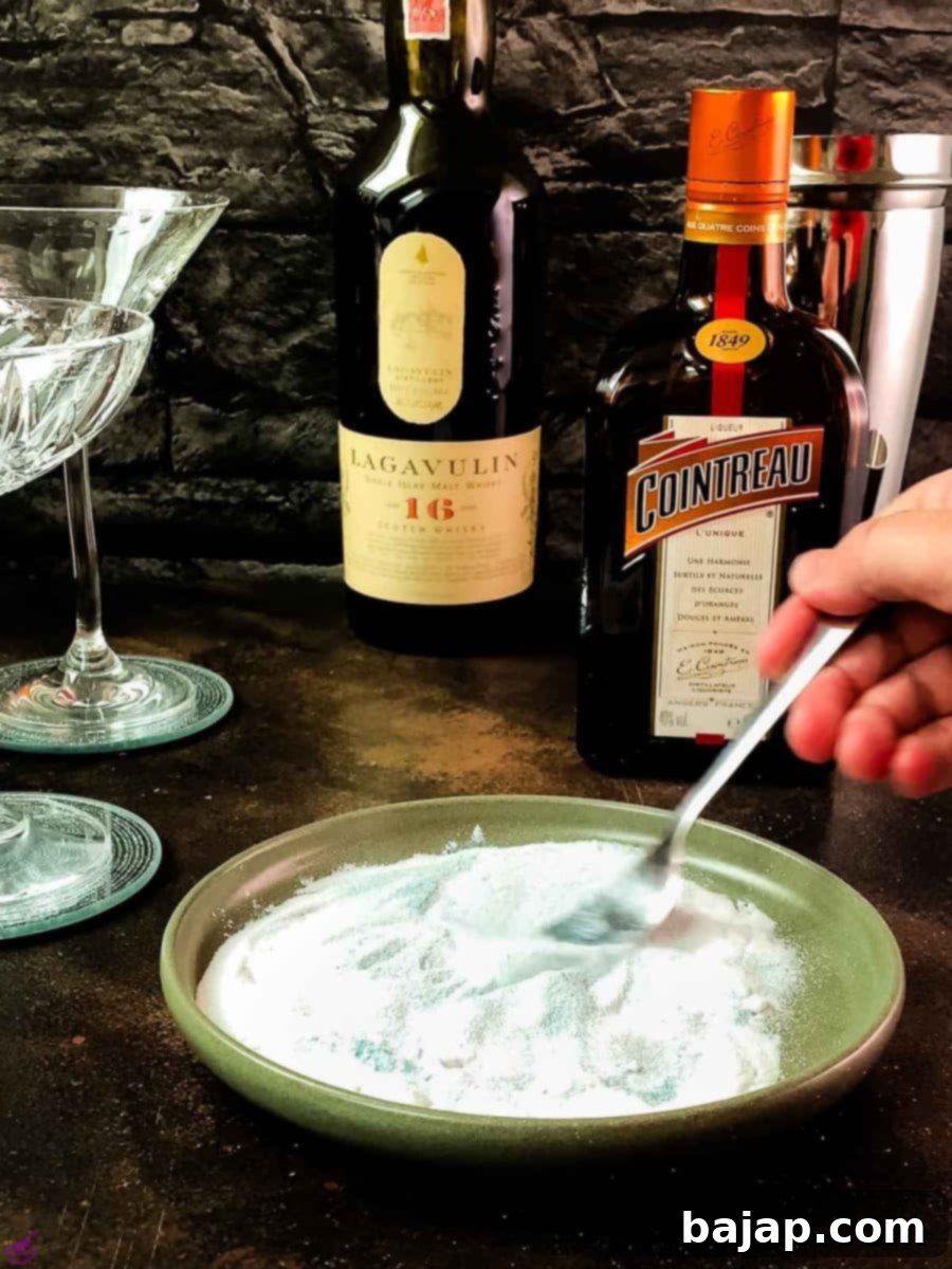 Lemon-Kissed Whiskey Sidecar 7 Mixing the superfine sugar and blue edible glitter thoroughly with a fork.
