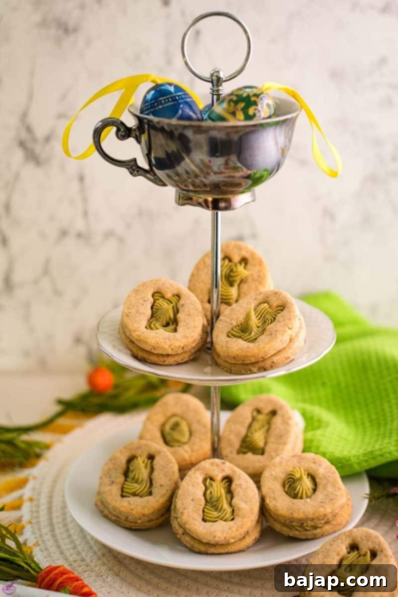 Gorgeous cut out Easter cookies with pistachio ganache placed on cute tray.