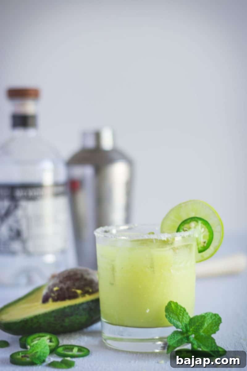 Spicy Avocado Margarita, a delicious and relaxing cocktail to unwind with.