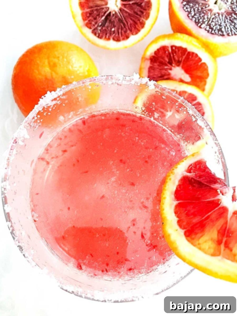 Blood Orange Vodka Martini, a perfect brunch drink: fizzy, tart, pink-tinted, using citrus vodka and fresh blood orange juice.
