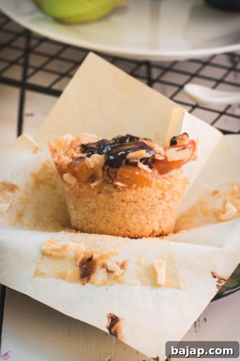 Easy Small Batch Dried Apricot Muffins 2 Delicious dried apricot breakfast muffins, with homemade caramel topping, sprinkled with melted chocolate after baking.