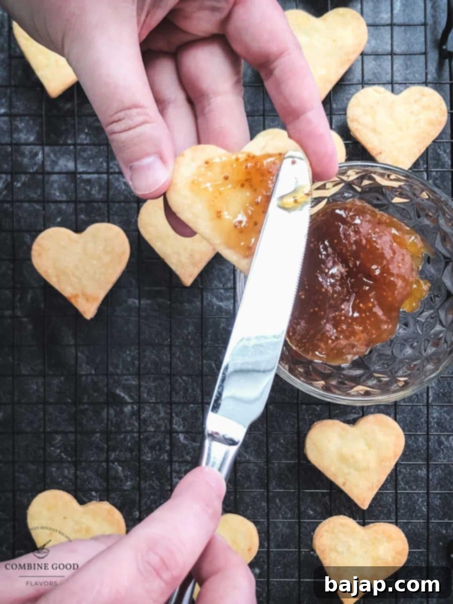 Spread fig jam on half of the baked cookies.
