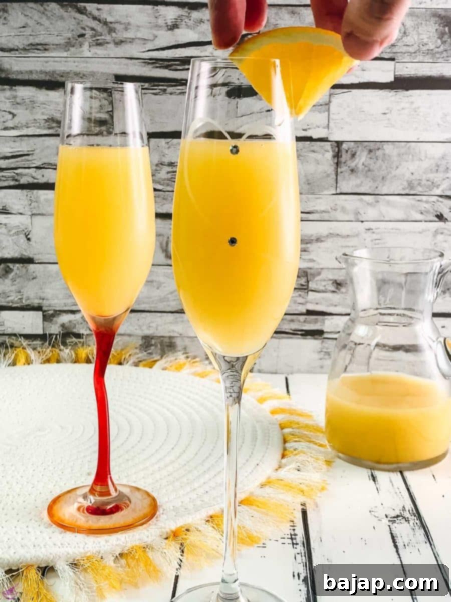 Garnish your classic mimosa with a little orange slice.