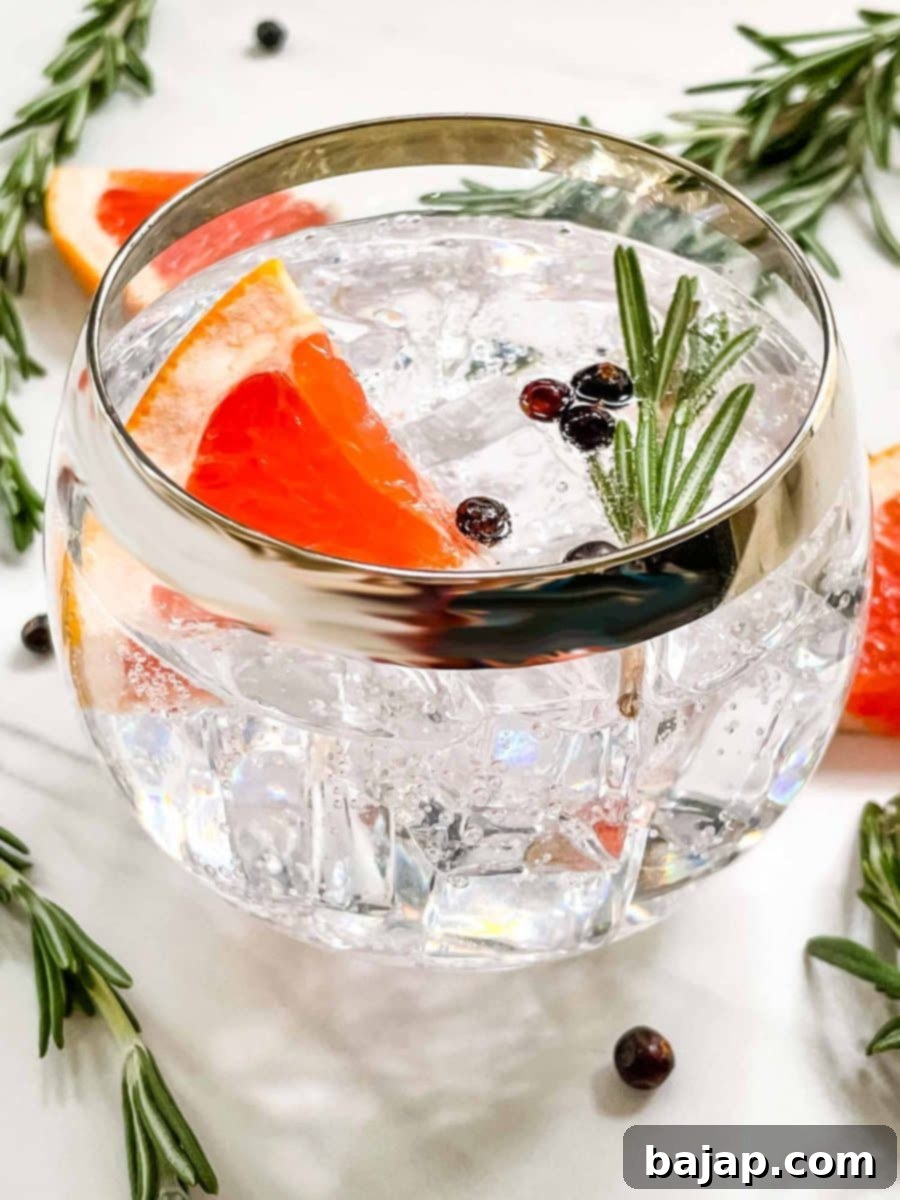 A beautifully garnished Barca Spanish Gin and Tonic with fresh herbs and citrus, showcasing its unique aromatic profile.