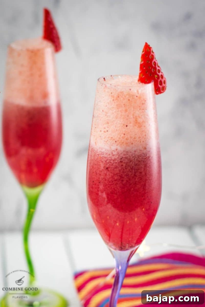 Close-up of vibrant berry mimosas in elegant champagne flutes, showcasing their beautiful color.