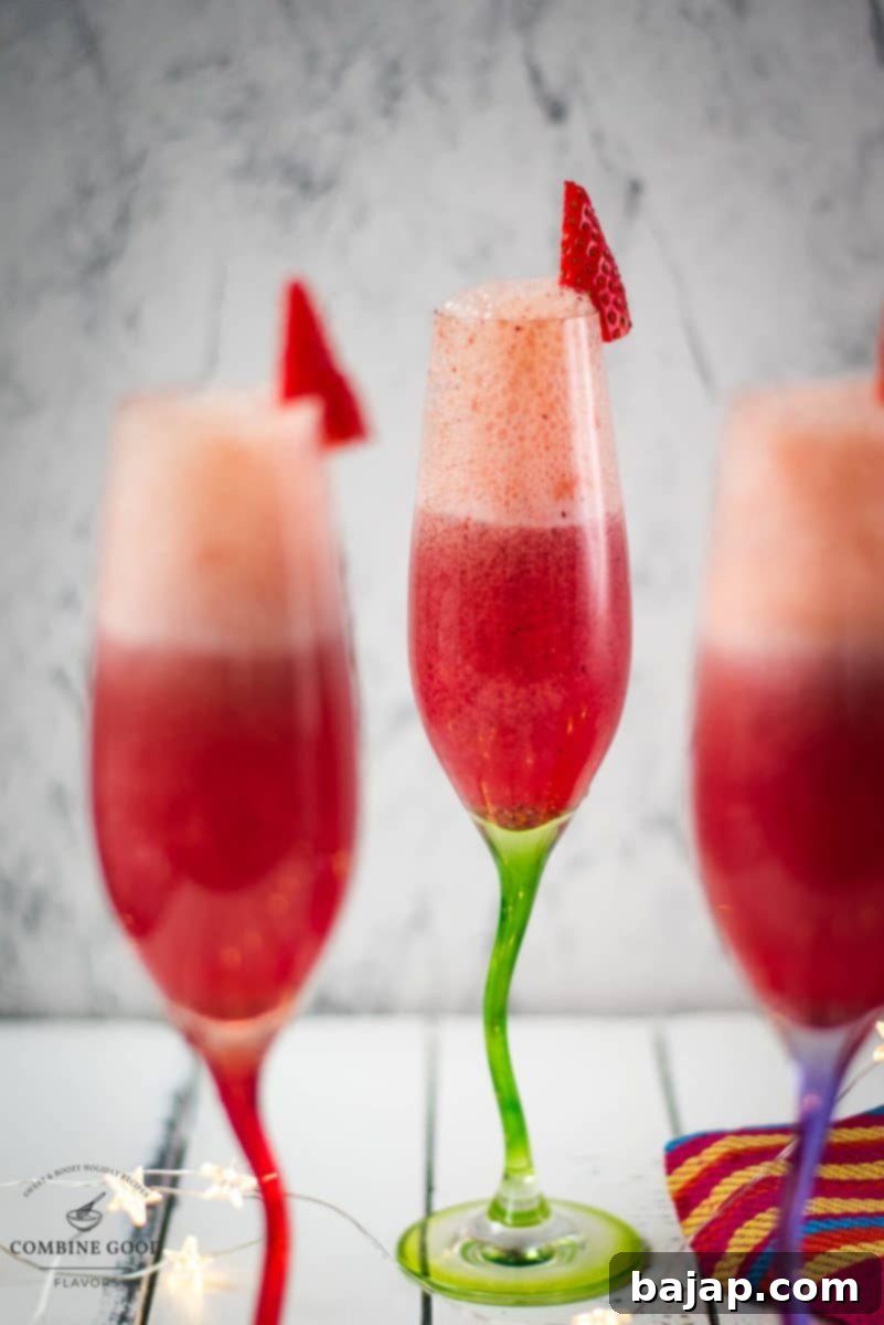 Elegant champagne flutes filled with berry mimosas, garnished and ready for a special occasion toast.