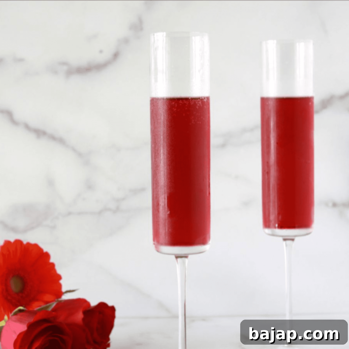 A festive Pomegranate Mimosa, combining bubbly Prosecco with sweet pomegranate juice for a fancy twist.