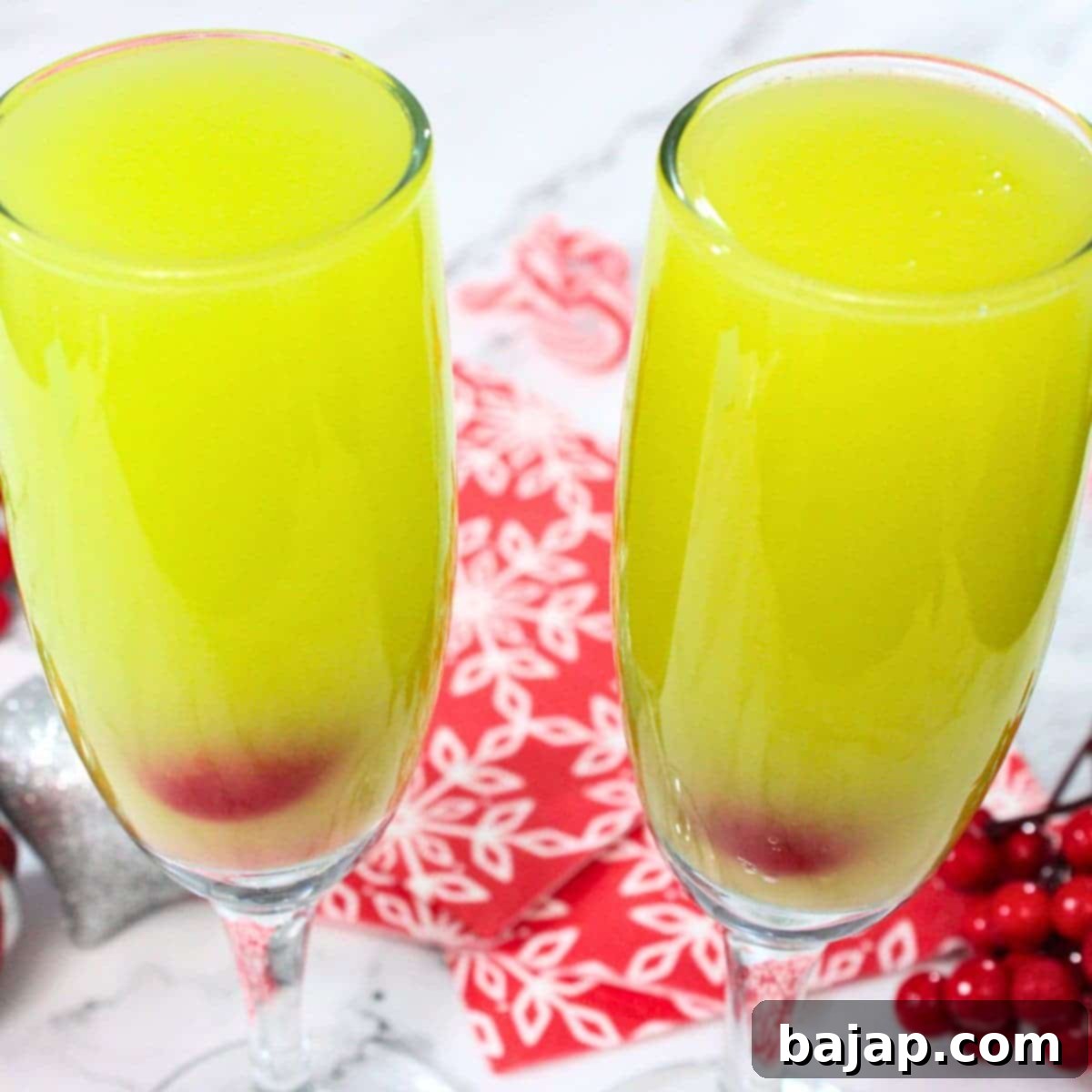 Festive and quick Grinch Mimosas, a 3-ingredient Whoville-inspired cocktail recipe perfect for holiday brunch.