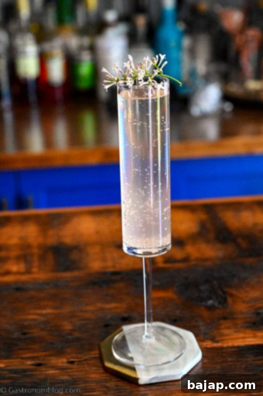 A delicate Lilac Mimosa made with homemade lilac syrup, a great spring and summer cocktail with a hint of lemon.